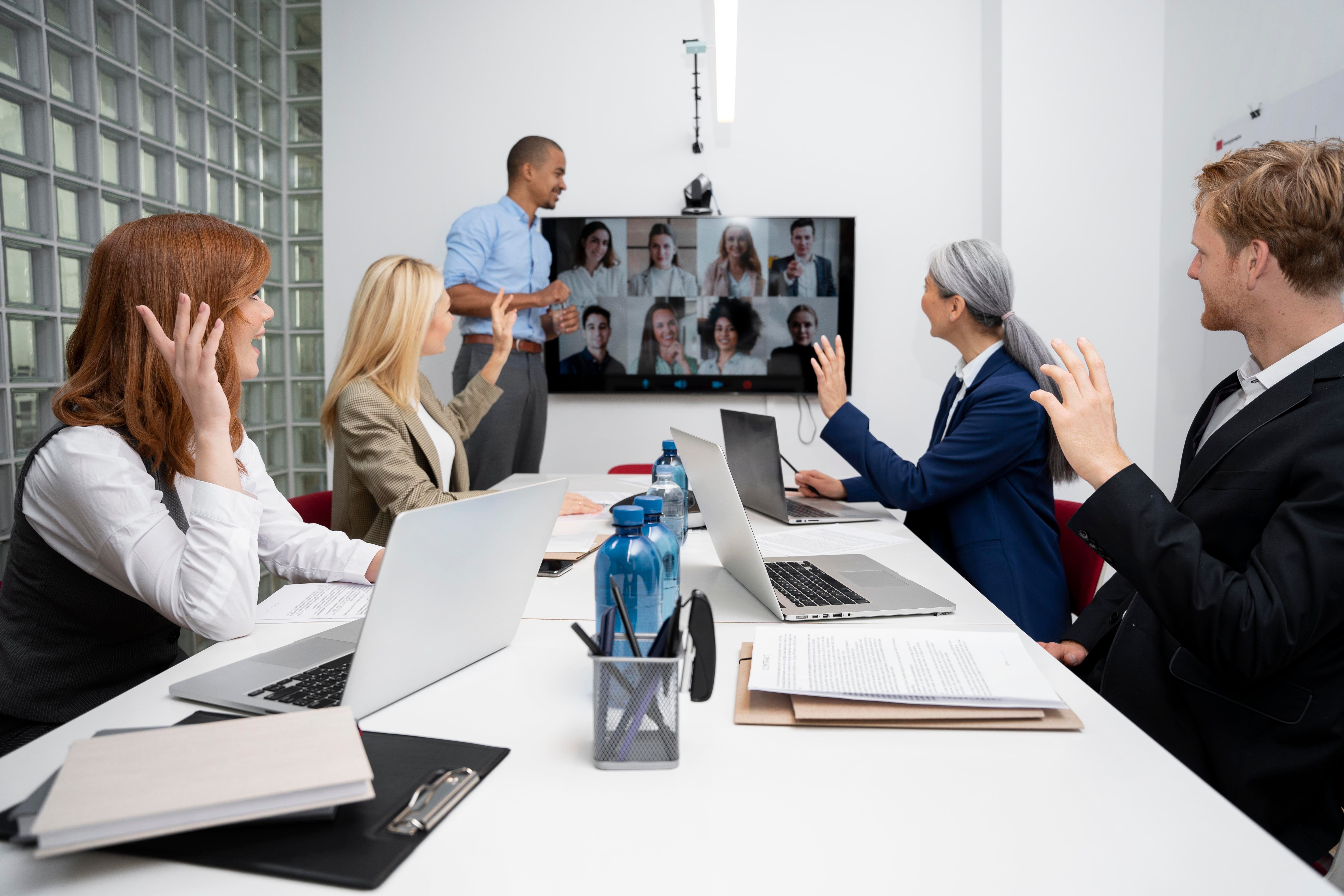 Clients in a conference room with professional commercial AV install