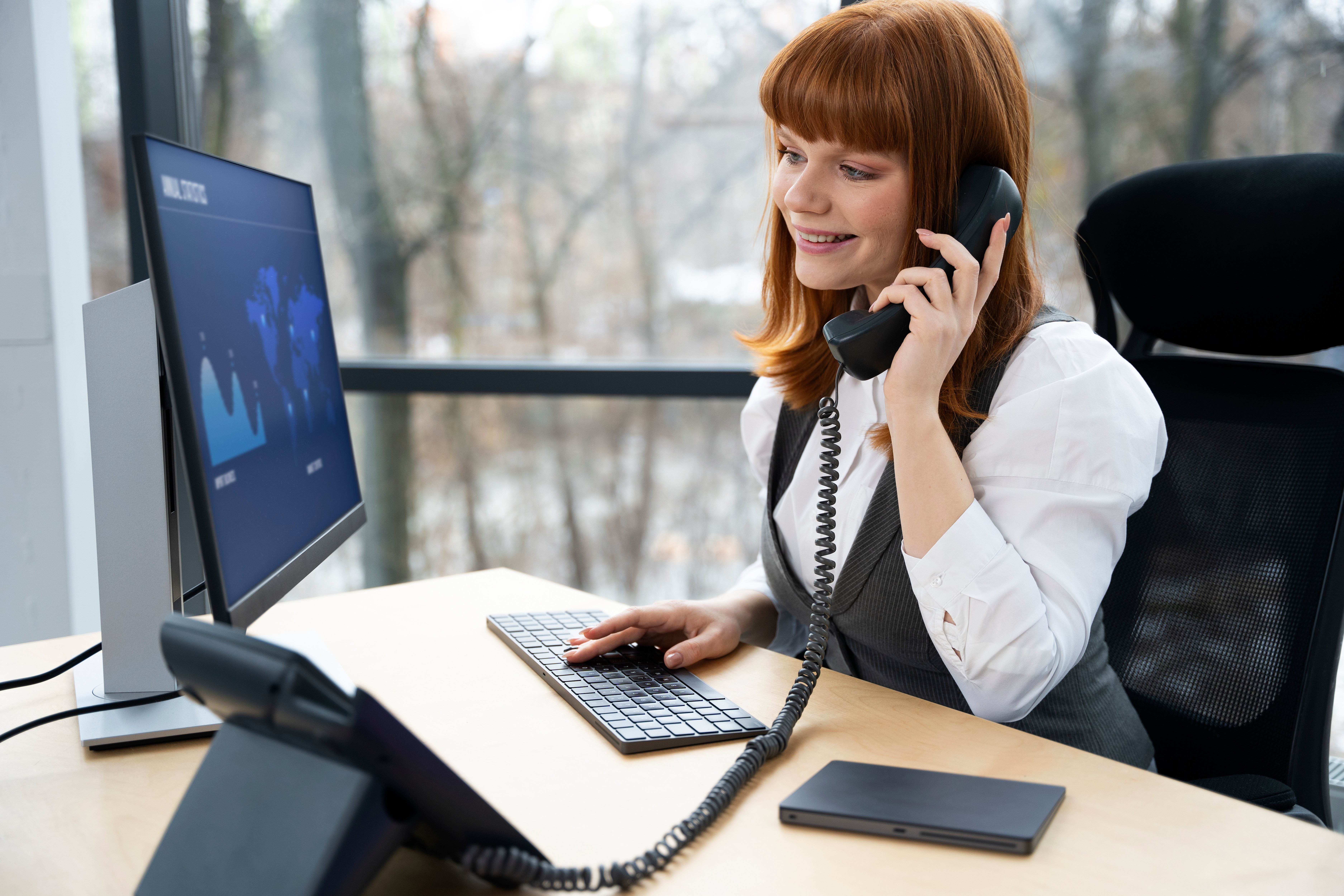 Businesswoman in Albuquerque using Proclaim VoIP phone system with support from Wired.